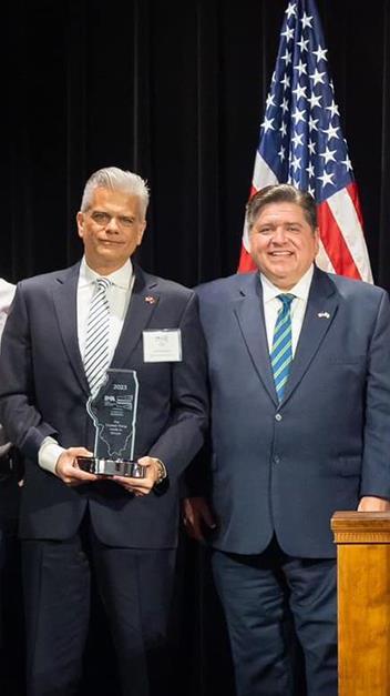 Award ceremony with Jeffrey Ahrstrom and JB Pritzker Jeffrey Ahrstrom with Governor JB Pritzker during ceremony